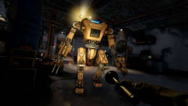 Facing a BARD robot attack in a dark hangar with only a torch for light during the Atomfall review, highlighting intense gameplay.