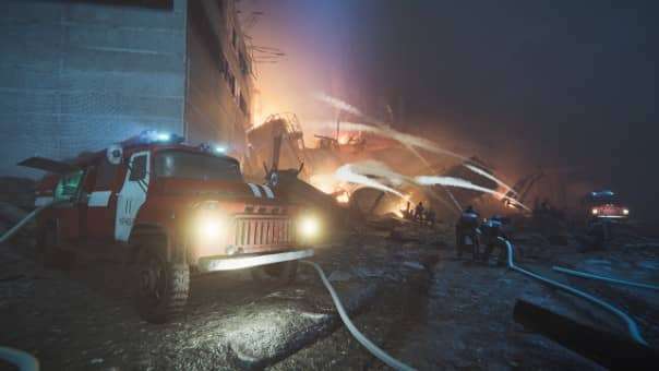 Isometric view of a firefighting team tackling a blaze in our Chornobyl Liquidators review, showcasing teamwork and intense gameplay.