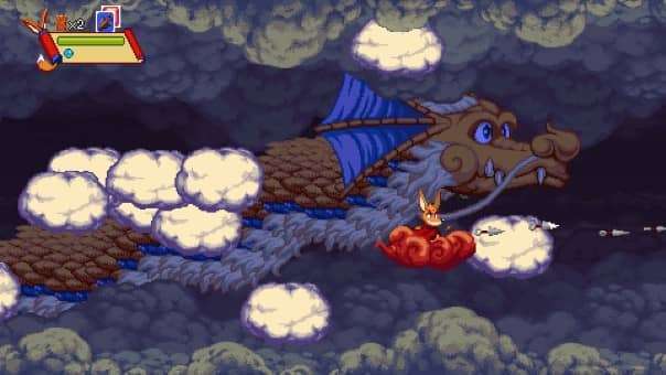 Flying on a cloud near a huge dragon in Kemono Heroes review, showcasing thrilling and imaginative platforming visuals.