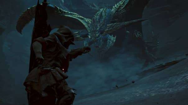 A hunter in the Monster Hunter Wilds review confronts Rey Dau in a dark, intense battle, showcasing thrilling high-stakes gameplay.
