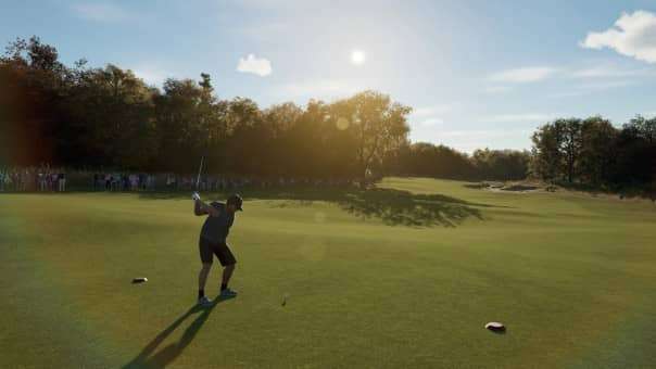 Golfer taking a side-on shot with the sun setting over trees in PGA Tour 2K25 review, emphasizing scenic realism and dynamic gameplay.