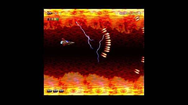 Rendering Ranger R2 Rewind Review – Intense spaceship combat in a fiery hellscape, dodging relentless enemy fire in a chaotic battle.
