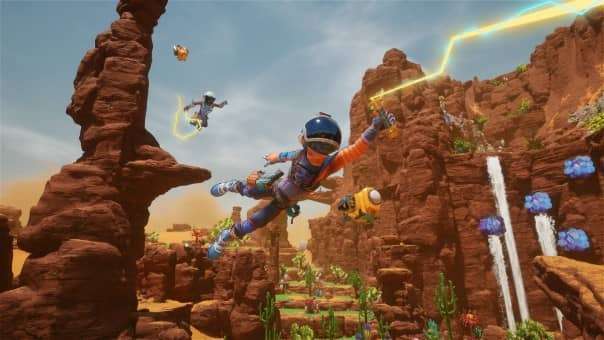 Your character soaring through the air using a slime-powered grapple hook in the Revenge of the Savage Planet review.