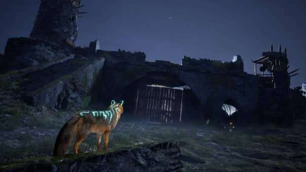 A mysterious scene in the Spirit of the North 2 review, as the fox surveys a derelict barracks under the moonlit sky.