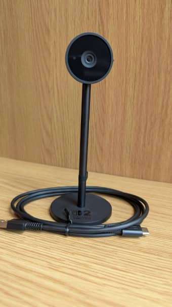 A front-facing shot of the Nintendo Switch 2 Camera with the shutter open, showcasing its sleek lens design.