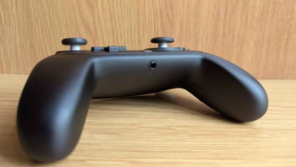 A detailed shot of the Nintendo Switch 2 Pro Controller, focusing on the 3.5mm audio jack in our review.