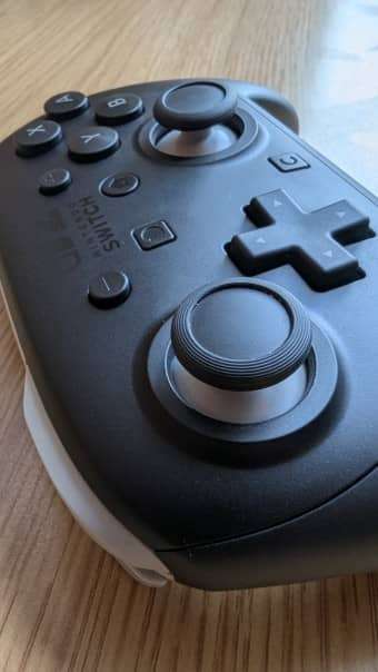 A close-up of the buttons and D-pad on the Nintendo Switch 2 Pro Controller, showcasing the Nintendo Switch 2 logo in our review.