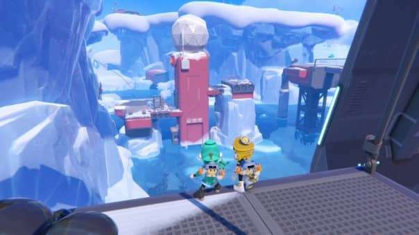 Two players stand on a high ledge in POPUCOM, gazing down at a vast snow-covered landscape below.