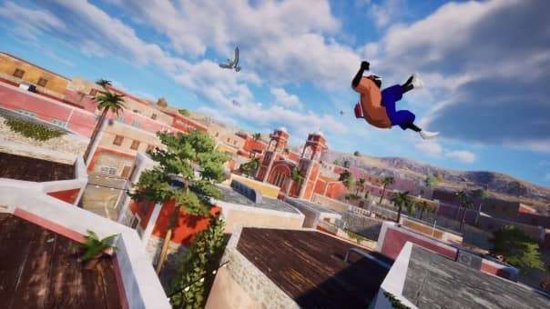 A Rooftops & Alleys freerunner mid-backflip, descending toward a high ledge above a picturesque small town.