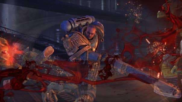 The Ultramarines captain clashes with an Ork in the Warhammer 40000: Space Marine Master Crafted Edition review, wielding a deadly chainsword.