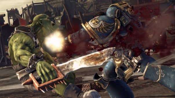 The Ultramarines captain lands a devastating punch on an Ork in the Warhammer 40000: Space Marine Master Crafted Edition review, showcasing raw power.