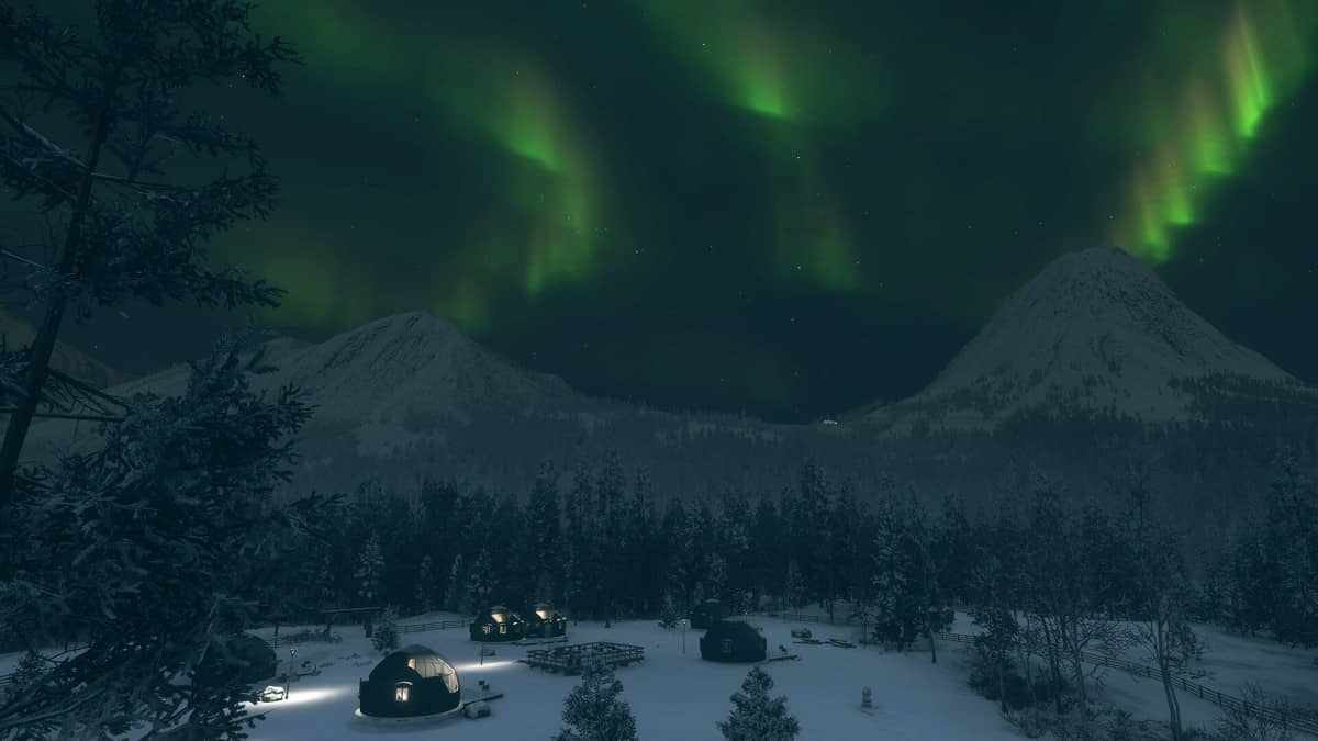 Aurora borealis glows above a warmly lit village in this Alberta Hunting Preserve review capture.