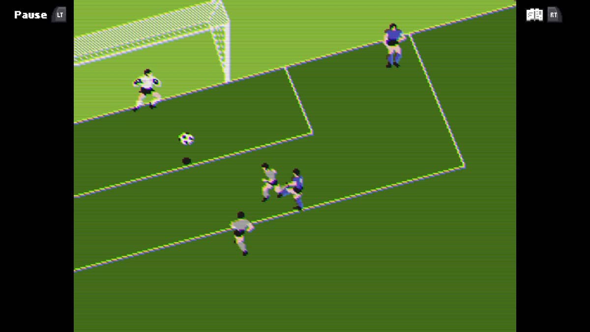 Player taking a goal-bound shot from the six yard box in our retro football review.