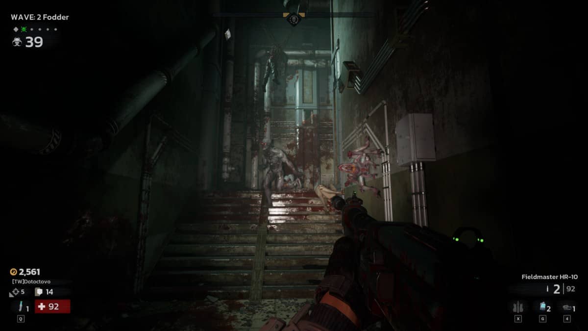 Killing Floor 3 moment as the player’s flashlight reveals a swarm of mutations descending a dark corridor staircase.