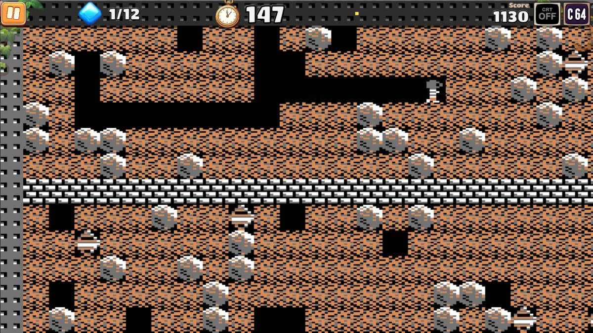 Classic Commodore 64 gameplay from BOULDER DASH 40th Anniversary featuring Rockford navigating pixel caves.