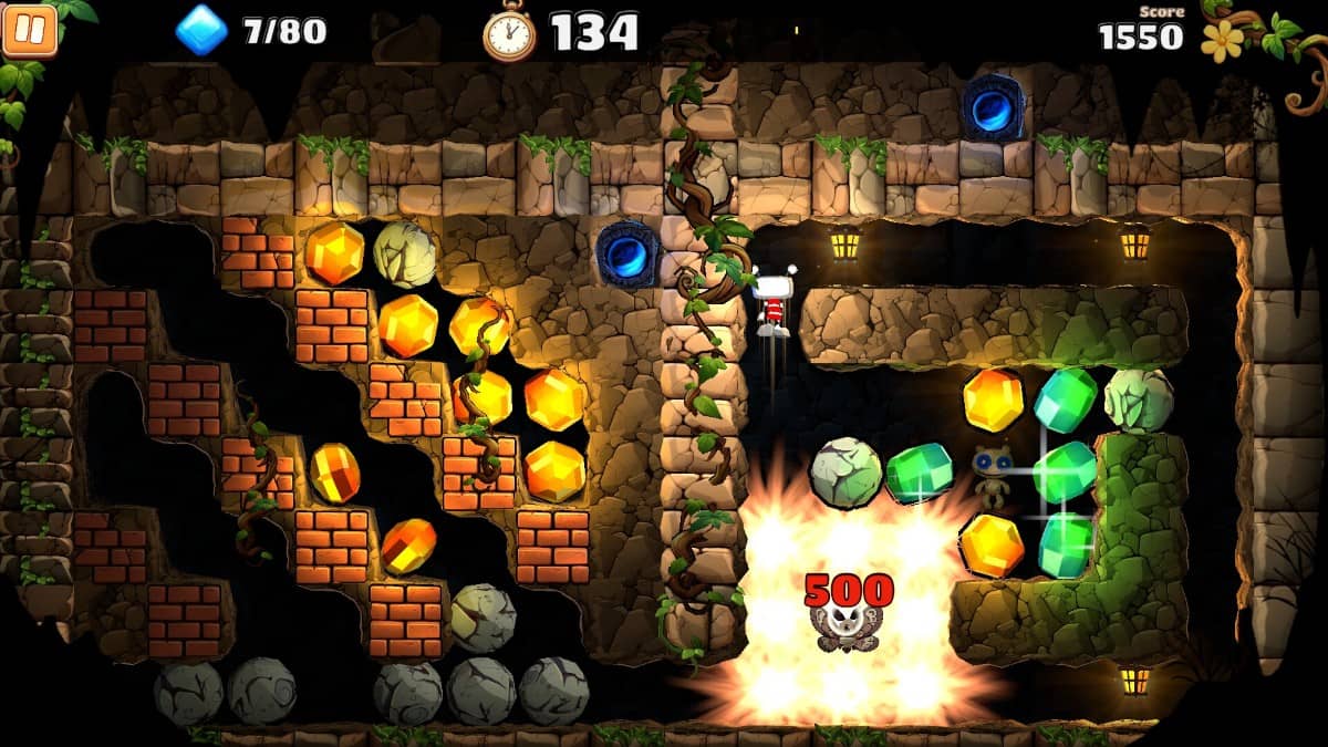 Rockford collects gems and detonates dynamite in BOULDER DASH 40th Anniversary’s explosive cave gameplay moment.