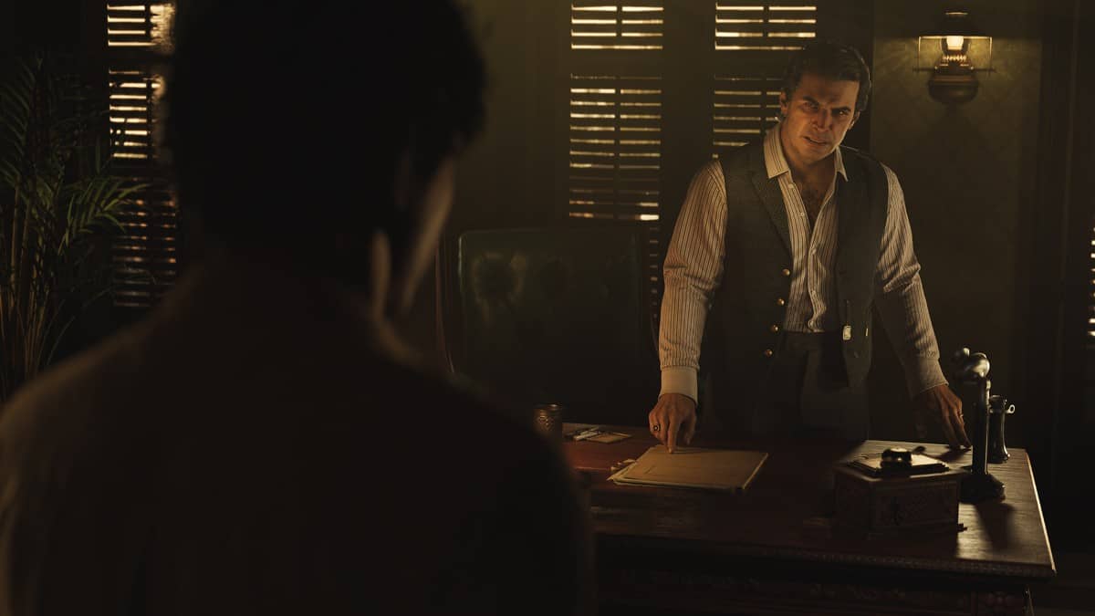 Don Torosi sits behind his ornate desk in Mafia The Old Country, setting the tone for a tense and pivotal first encounter.