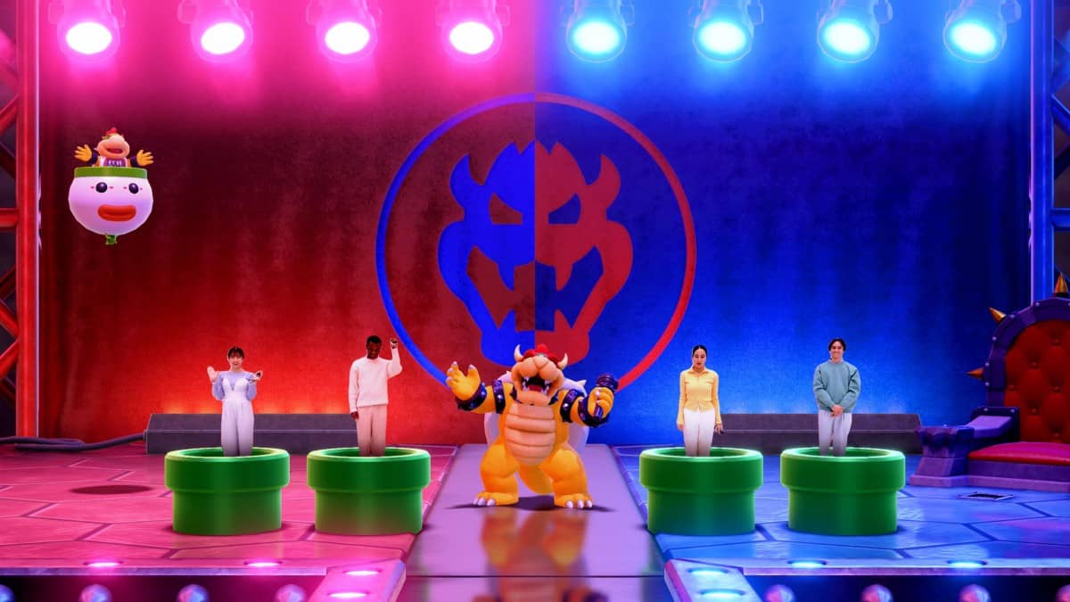 Bowser stands center stage as real players appear in green pipes during the finale of Super Mario Party Jamboree – Nintendo Switch 2 Edition + Jamboree TV.