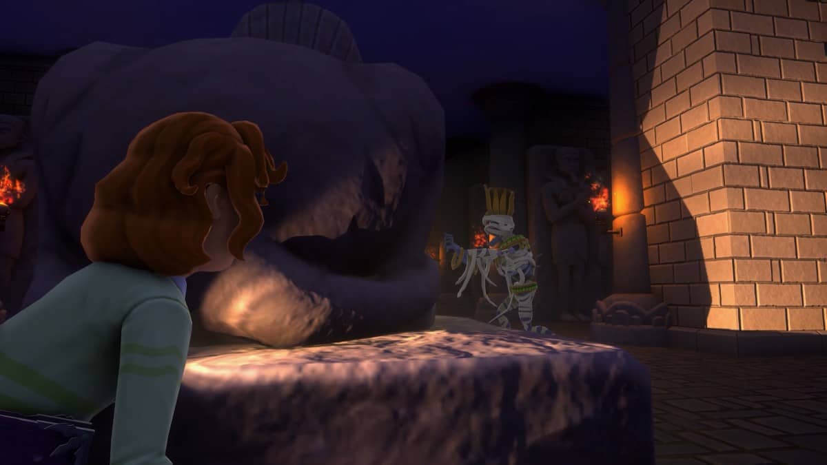The main character hides behind a rock as a mummy hobbles past in Goosebumps: Terror in Little Creek.