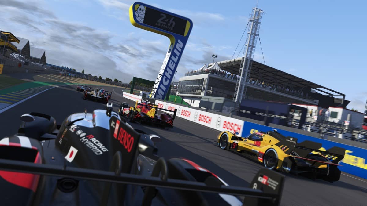 Cars in Le Mans Ultimate speeding past the finish line in a dramatic, high-detail racing moment.