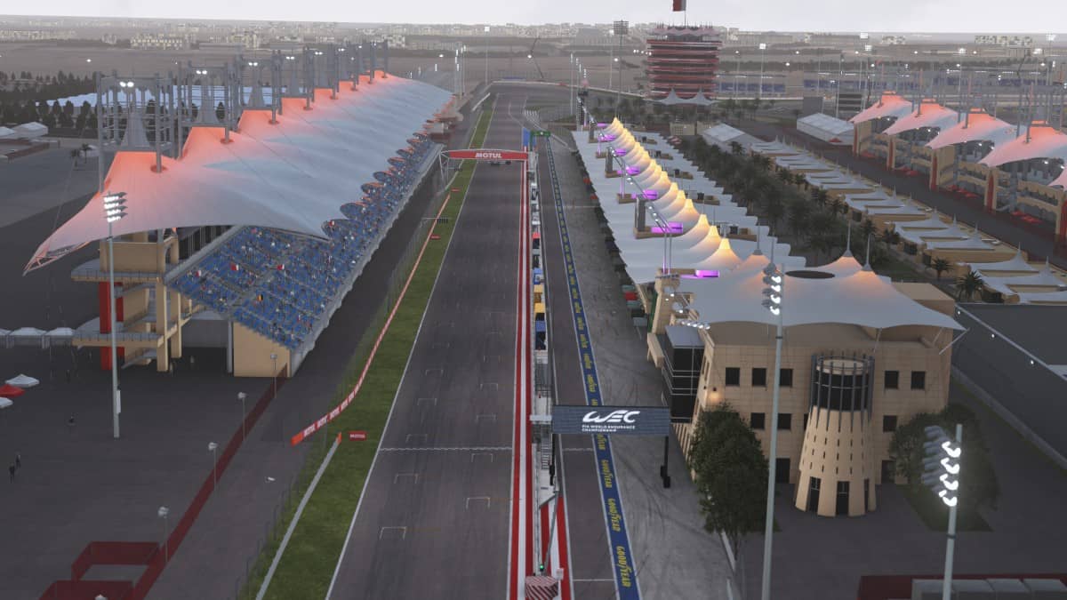 Aerial view of the Le Mans Ultimate paddock and starting line, showcasing track layout and pre-race atmosphere.