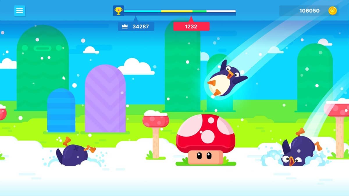 A penguin prepares to bounce off a mushroom in Bouncemasters, set in a vibrant woodland stretch of the snowy landscape.