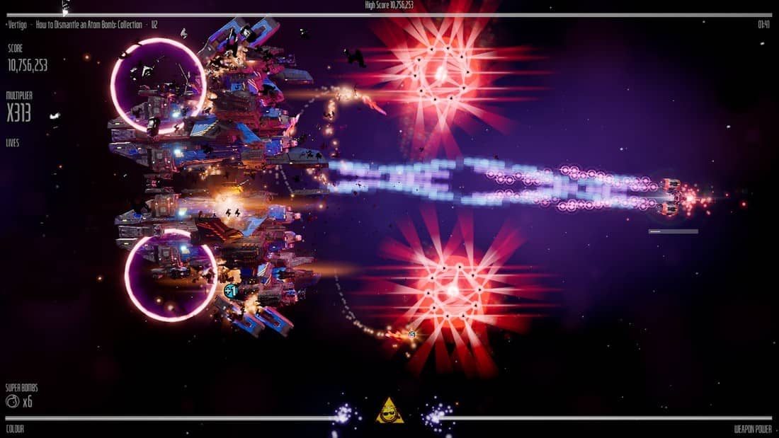 Frantic in-game shooting in Beat Hazard Arcade with projectiles, enemies, and visual chaos filling the screen.
