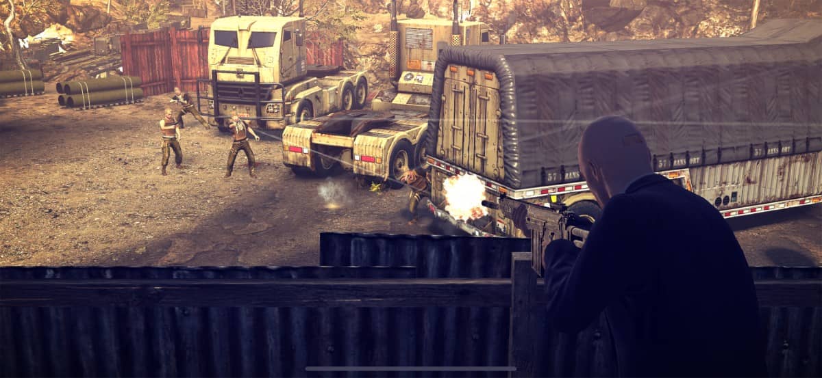 Agent 47 fires from behind cover at enemies inside a military base in Hitman Absolution Android Edition.