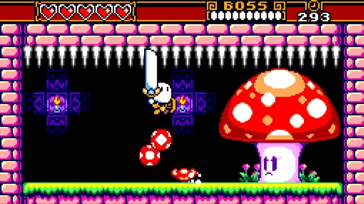 Sir Noggin faces a towering mushroom boss while spikes loom across the ceiling above.