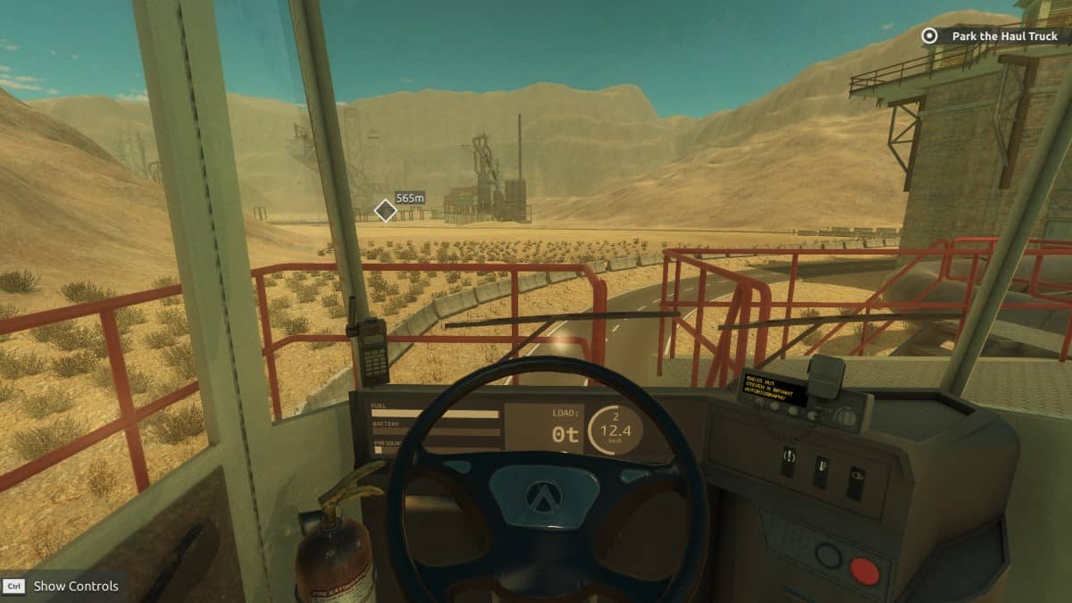 First-person cockpit view of the T-Rex digger controls and wheel in Giant Machines 2017.