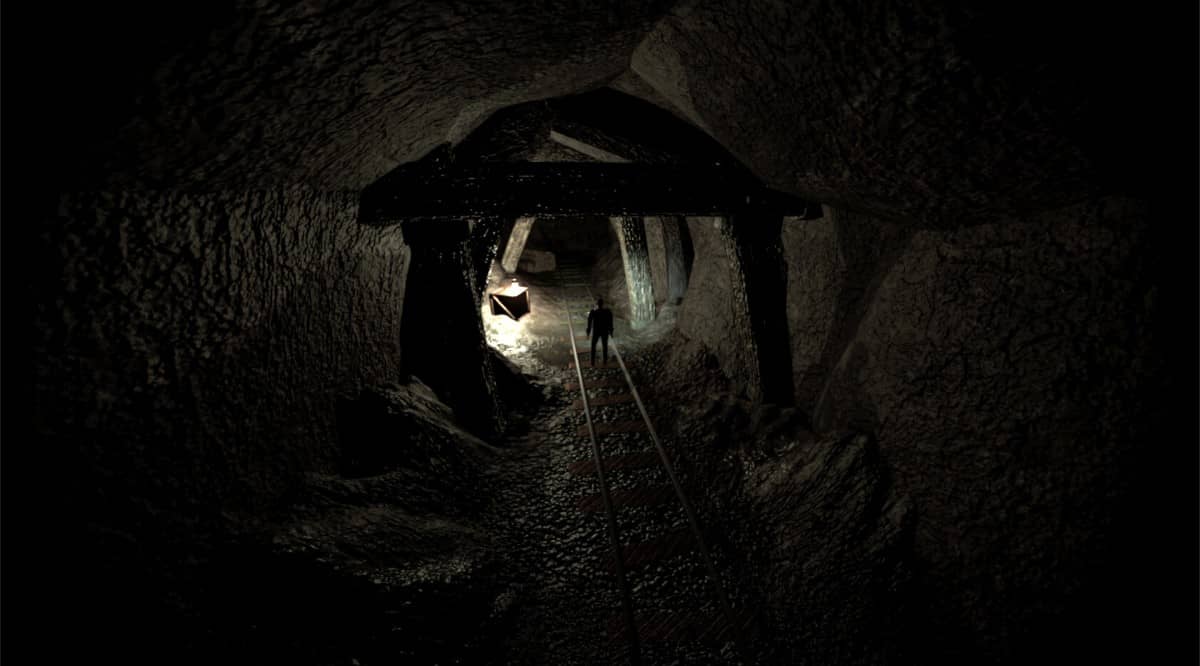 Your character stands at the entrance of a vast cave in The Order of the Snake, framed by looming darkness.