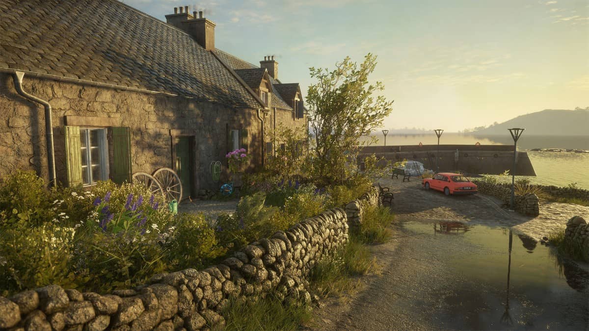 A quaint coastal house with cars outside in theHunter Call of the Wild Scotland Hunting Reserve overlooking the sea.