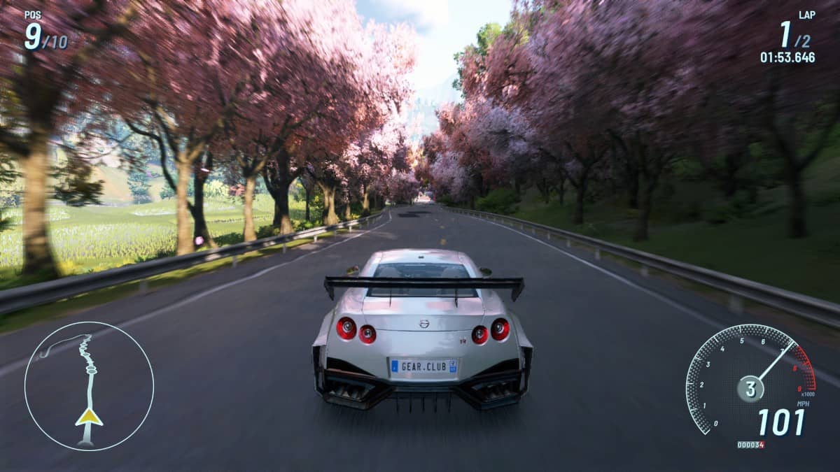 Gear.Club Unlimited 3 showing a new Nissan Skyline racing down a blossom-lined road in Japan with vibrant detail.