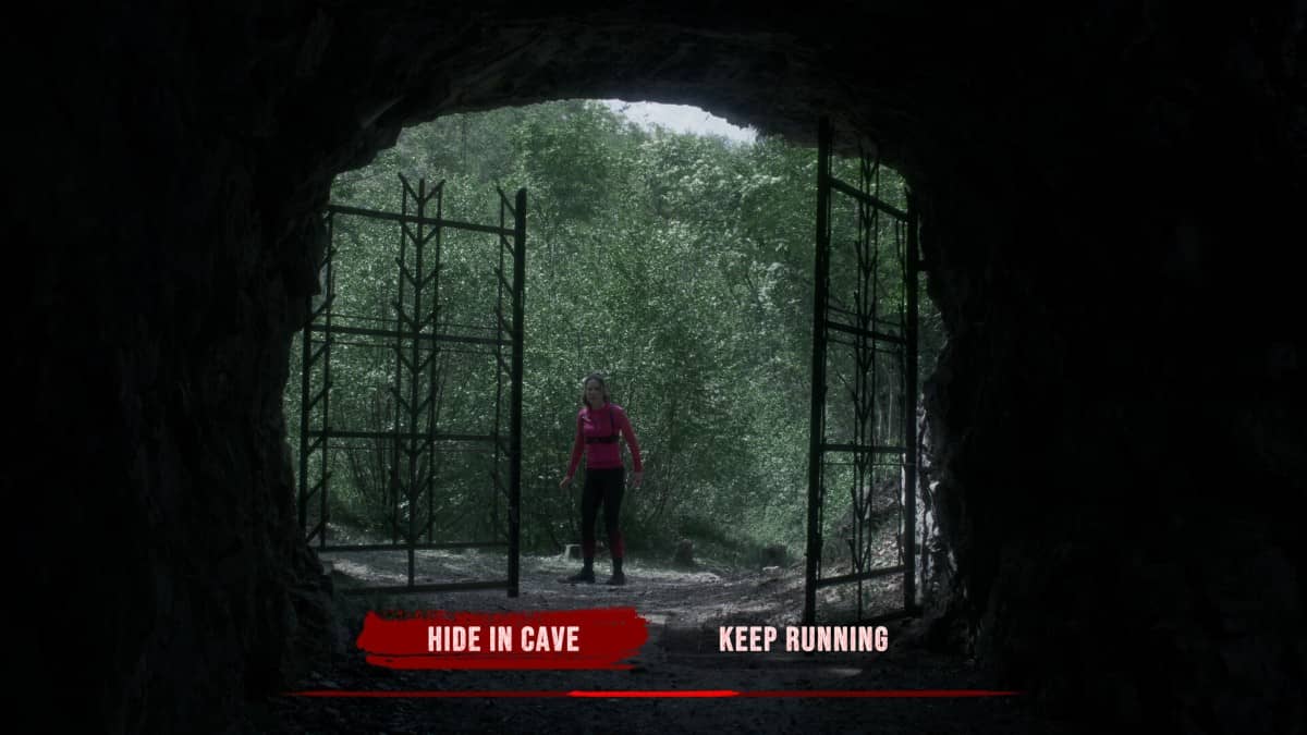 Choice options appear clearly in The Run as we look from the cave toward Zanna standing outside.