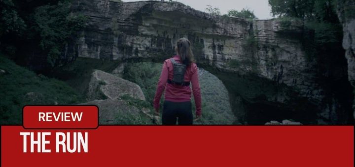 Zanna facing two masked men on a ridge in the forest in The Run during a tense moment.