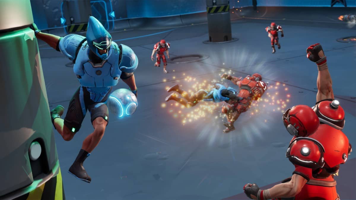 A blue Speedball player runs up the wall to dodge a tackle while lining up a powerful throw.