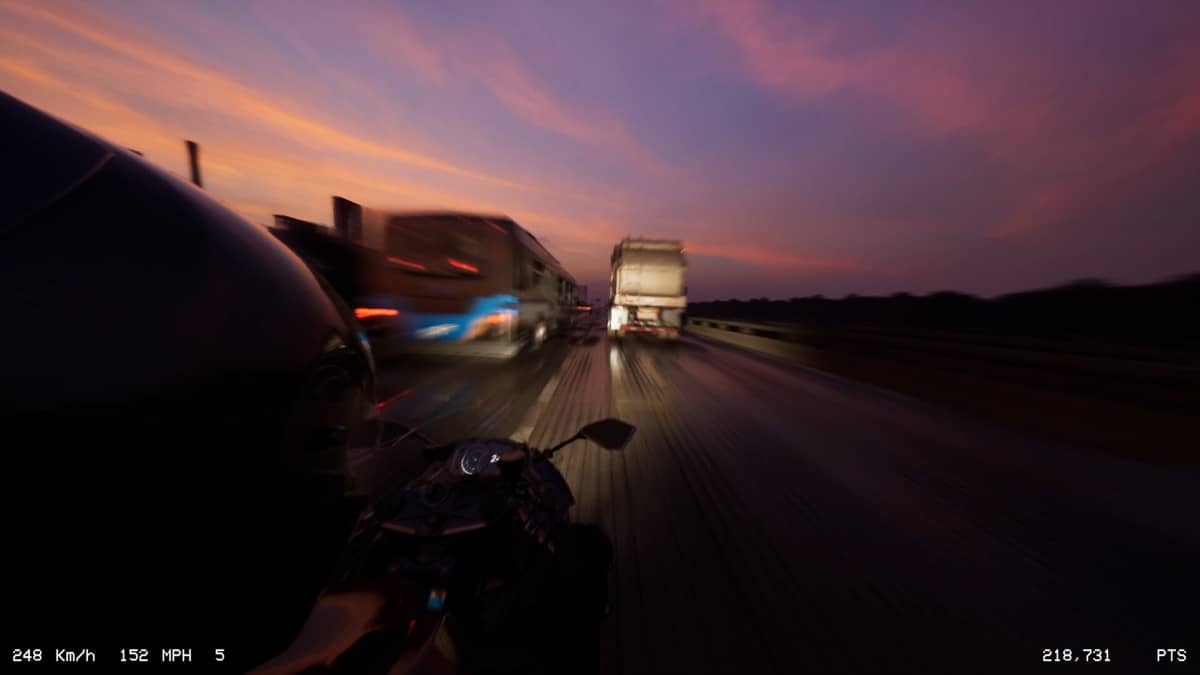 Gert Lush Gaming weaves through approaching heavy traffic during a high-speed Lanesplit highway run.