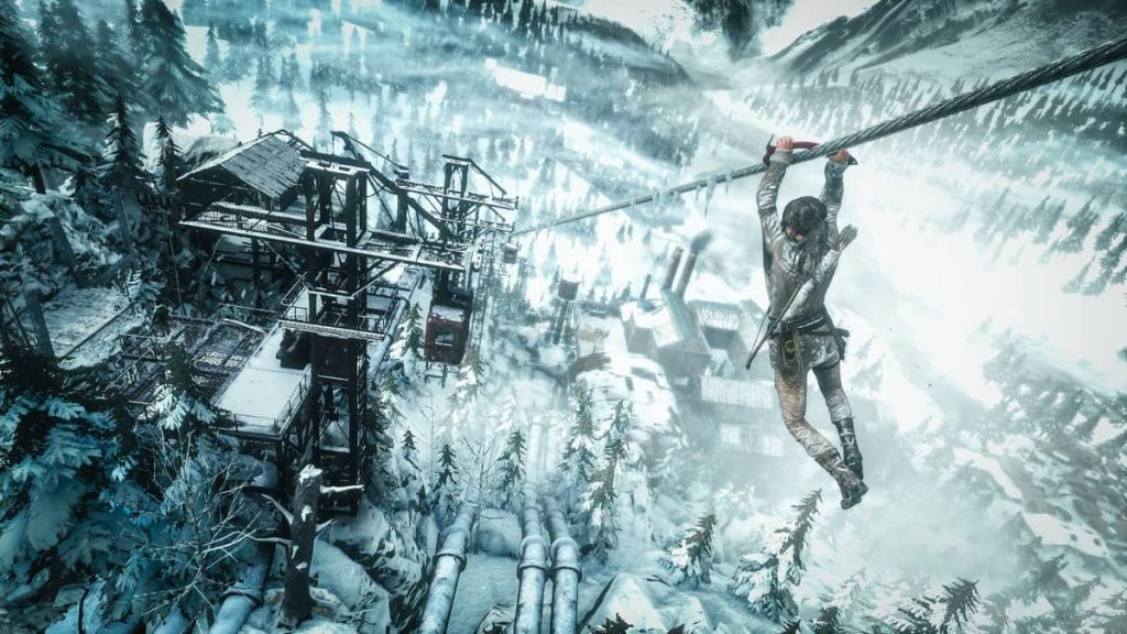Lara Croft uses her climbing axe to slide down a rope in Rise of the Tomb Raider on Gert Lush Gaming.