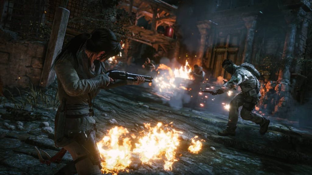 Lara Croft aims a shotgun at a rushing enemy in Rise of the Tomb Raider on Gert Lush Gaming.